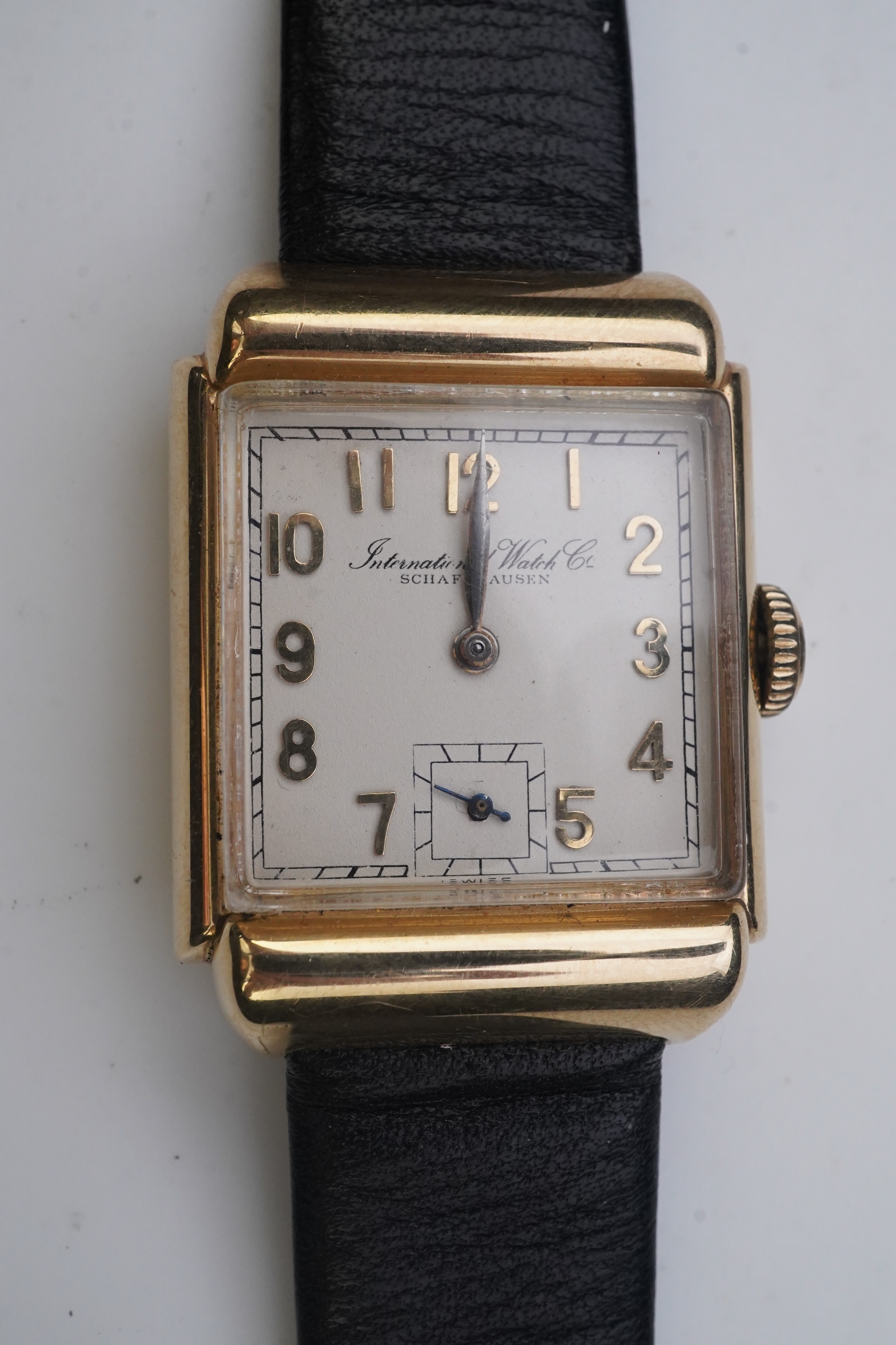 A gentleman's mid 20th century 14k gold International Watch Company manual wind wrist watch, on a later associated leather strap